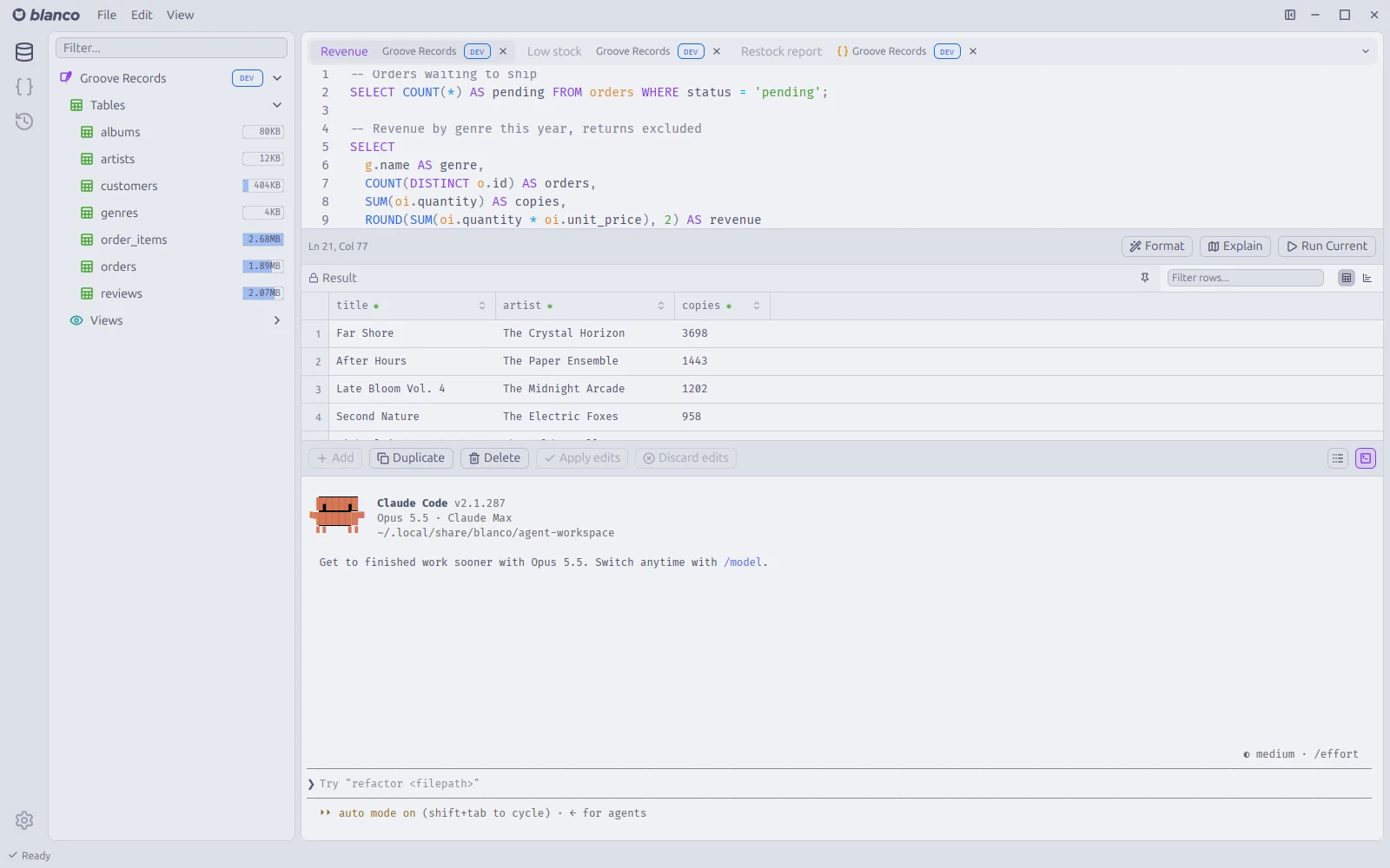 A query tab with a terminal docked under the results, running Claude Code